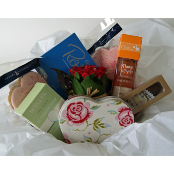 Great assortment of gifts in this Cake Tin Great assortment of gifts in this Cake Tin flowers delivery - Flowers Auckland